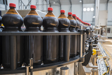 Close up of plastic bottle industry on a conveyor belt