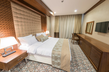 Fototapeta na wymiar Modern hotel room with big bed