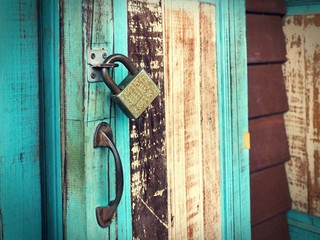Closeup vintage wooden door with lock
