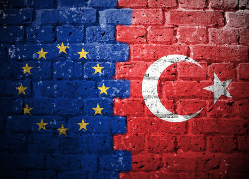 EU and Turkish Flag on Brick Wall
