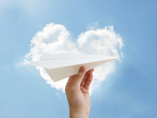 paper plane throwing heart cloud