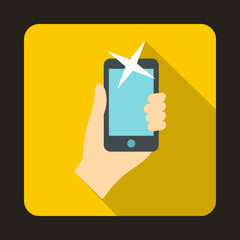 Hand photographed on a mobile phone icon in flat style with long shadow. Device symbol