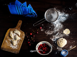 cooking dumplings on the kitchen table. top view of the products and kitchenware