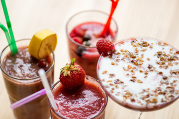 glasses of smoothies on a white background