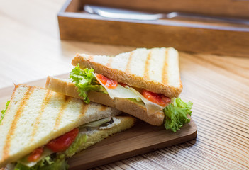 sandwiches on a wooden board