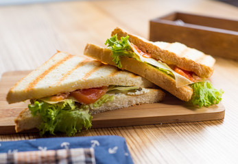 sandwiches on a wooden board