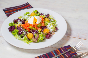 dish of salad with vegetables and meat