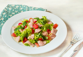 dish of salad with vegetables and meat