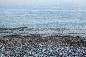 Calm Baltic sea coast seascape with pebbles