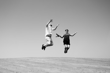 senior couple jumping