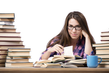 Young student preparing to the college exams isolated on white