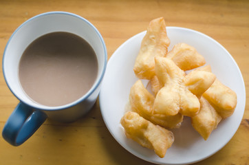 Coffee with fried bread stick, Thai style food.