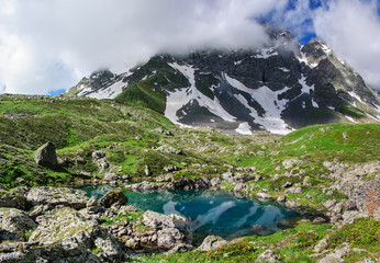 Picturesque lake in valley of Caucasus mountains