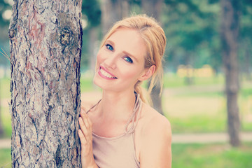 Young beautiful happy woman in park summer outdor