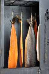 Smoked salmon fish in a smoker