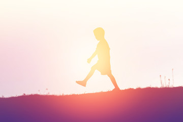 kid silhouette,Moments of the child's joy. On the Nature sunset