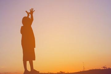 kid silhouette,Moments of the child's joy. On the Nature sunset