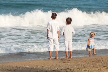 Happy Brothers playing on beach, Spain