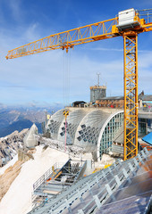The crane on Germany's highest construction site in 2962m. Building the new Zugspitze cable car for...