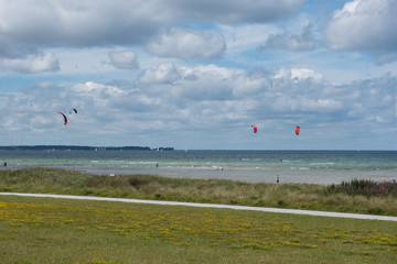 view over the baltic sea with sailboats and kites