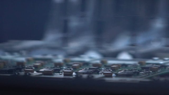 On the green IC chip is automatically applied. Producing Printed Circut Board.