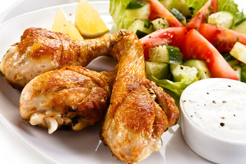 Roasted chicken drumsticks and vegetables
