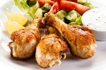 Roasted chicken drumsticks and vegetables