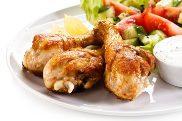 Roasted chicken drumsticks and vegetables