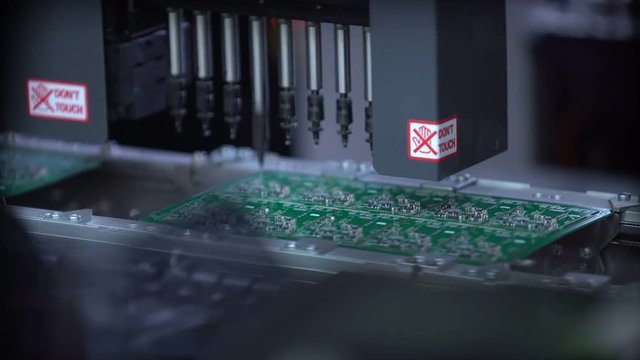 Producing Printed Circut Board. High-tech manufacturing.