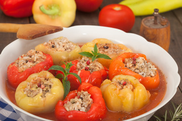 Bell peppers filled with minced meat, rice and vegetables in a bowl