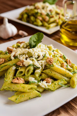 Penne pasta with spinach pesto, walnuts and mozzarella