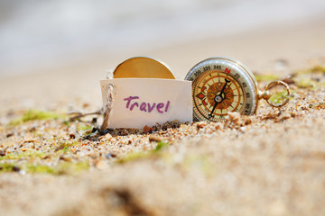 Compass in the sand with Message - Travel