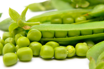 Pods of green peas isolated on a white background. Green, ripe, fresh vegetables. Legumes.