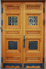 the front carved wooden door with glass inserts, the main entrance