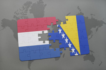 puzzle with the national flag of netherlands and bosnia and herzegovina on a world map background.