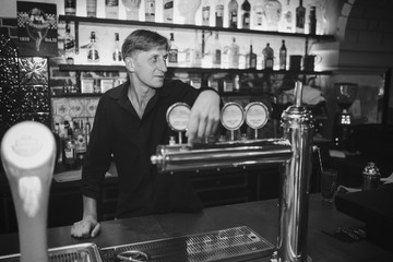 Barman at work in the pub