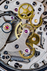 Chronograph watch movement close-up.