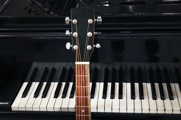 Fototapeta na wymiar Guitar with piano, close up