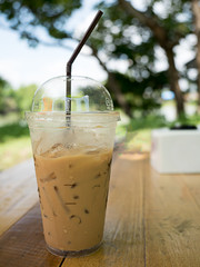 ice coffee on wooden in the garden