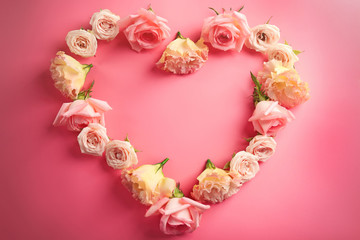 Heart shaped roses on pink background