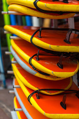 Surf boards in a stack