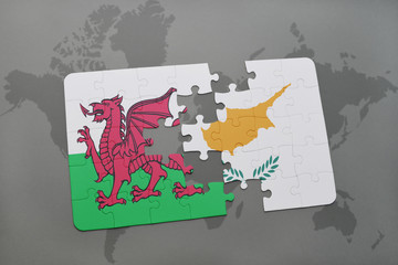 puzzle with the national flag of wales and cyprus on a world map background.