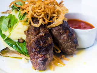 cutlets with mushrooms, potatoes, onions and tomato sauce