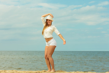 Young joyful girl on beach.