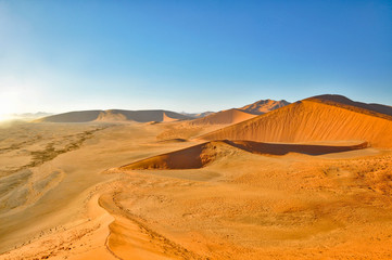 Naklejka na ściany i meble The large sand dunes in the Namib Sand Sea in Namibia Africa. The Namib Sand Sea is listed in the World Heritage list.