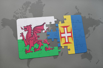 puzzle with the national flag of wales and madeira on a world map background.
