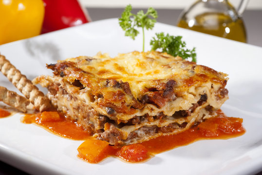 italian lasagna on a square plate