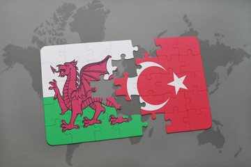 puzzle with the national flag of wales and turkey on a world map background.