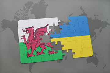 puzzle with the national flag of wales and ukraine on a world map background.