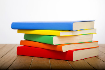 colorful books on wooden table